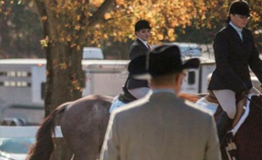 judge watching riders on horses