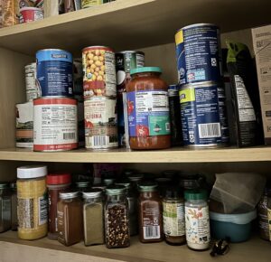 cans and jars on cupboard shelves