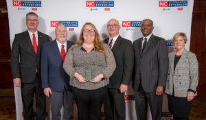 Group photo of Abby Whitaker and NCSU and NC A & T Extension Administration