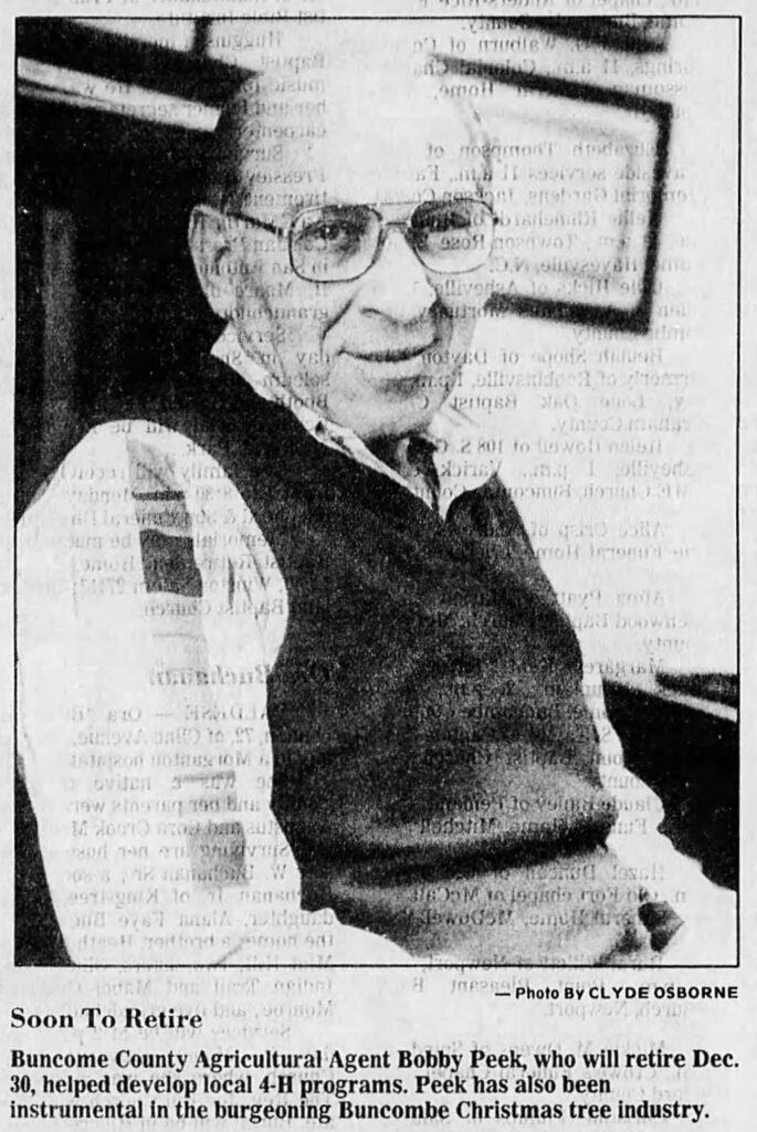 Black and white newspaper photo from 1988 of Bobby Peek, Agricultural Agent with Buncombe County Cooperative Extension.