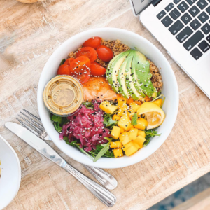 bowl with avacado tomatoes lettuce and onions